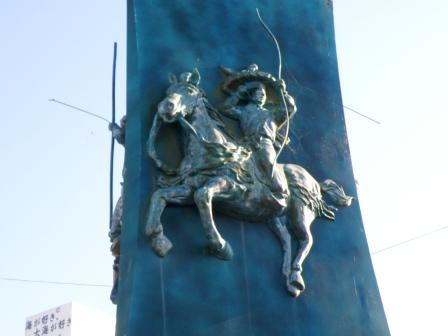 a statue of archery on horseback